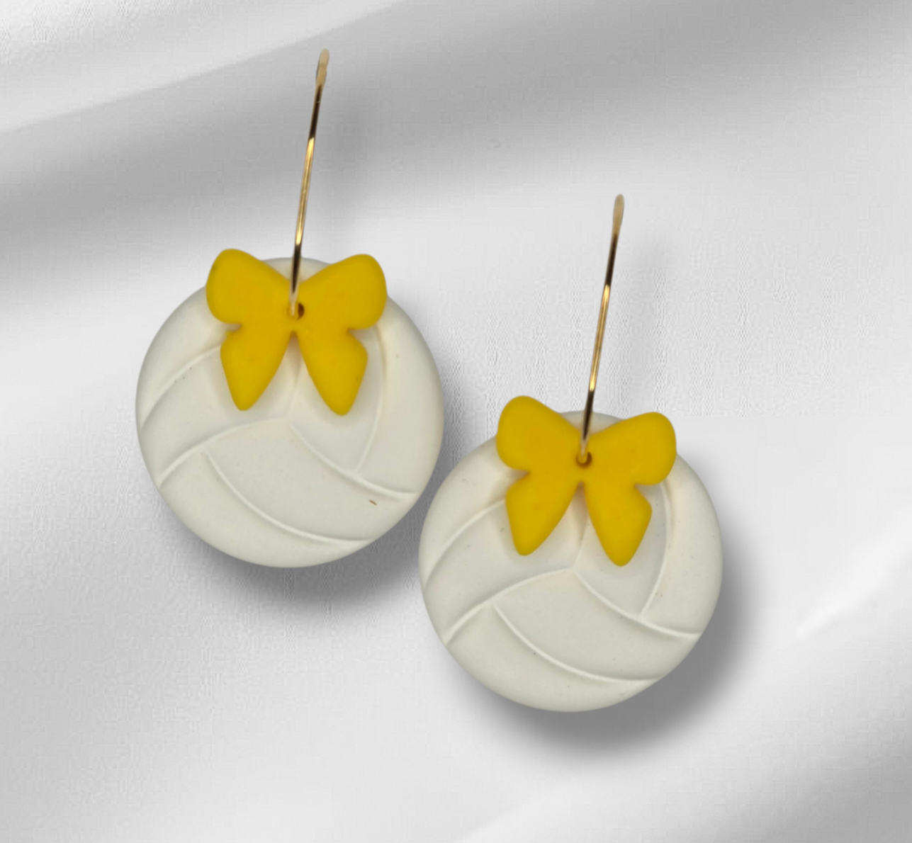 Volleyball with bow hoop earrings