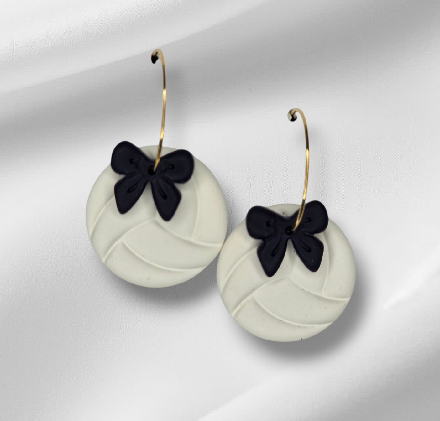 Volleyball with bow hoop earrings