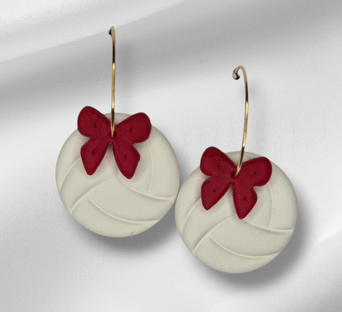 Volleyball with bow hoop earrings